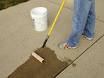 rolling on concrete sealer