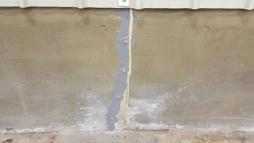 Repaired and sealed concrete wall crack