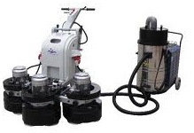 Concrete floor grinder with vacuum attachment