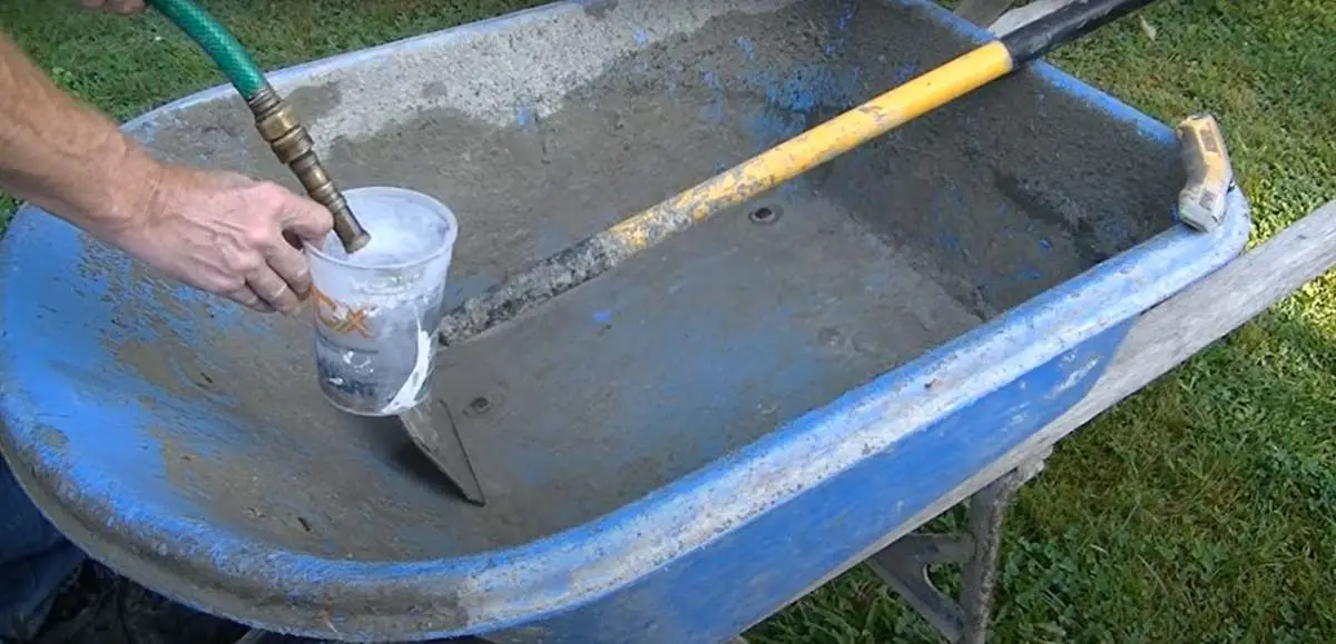 mix concrete by hand in a wheel barrow